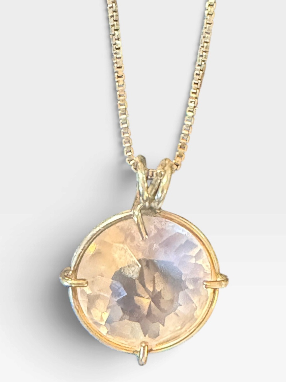 Rose Quartz Round Pendant Gold Tone pendant on necklace